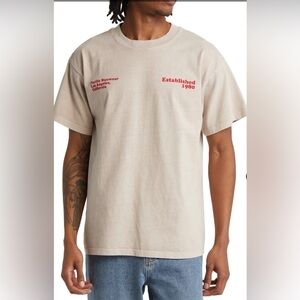 PacSun Pacific Sunwear man Tan T-Shirt with orange Text, Small, bold, cotton